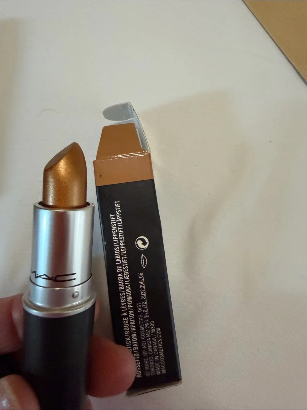 Assortment of women’s lipsticks, eyeliner, eyeshadow, bronzing drops